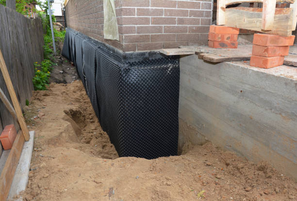 SJ Waterproofing Pros technician performing targeted Waterproofing assessment in Bucks, AL